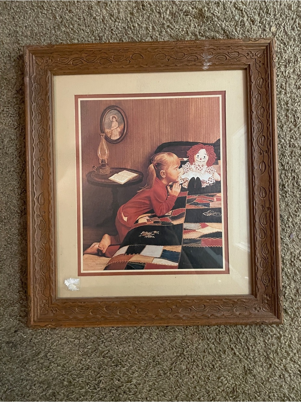 Framed Wall Art Featuring Girl and Rag Doll in Brown Frame